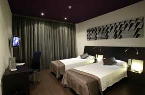 Family triple with city view, queen bed, and private facilities (bath and shower)